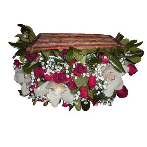 Flower Arrangements in trunk with red roses and white orchids(cymbidium) and gypsophila